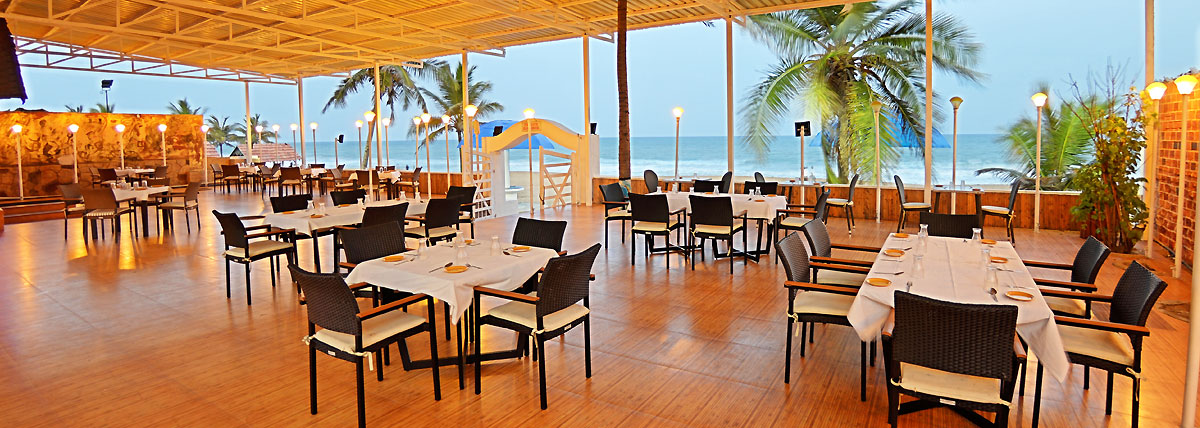 Dining arrangement of beach restaurant with spectacular view of the beach in Bluebay beach restaurant