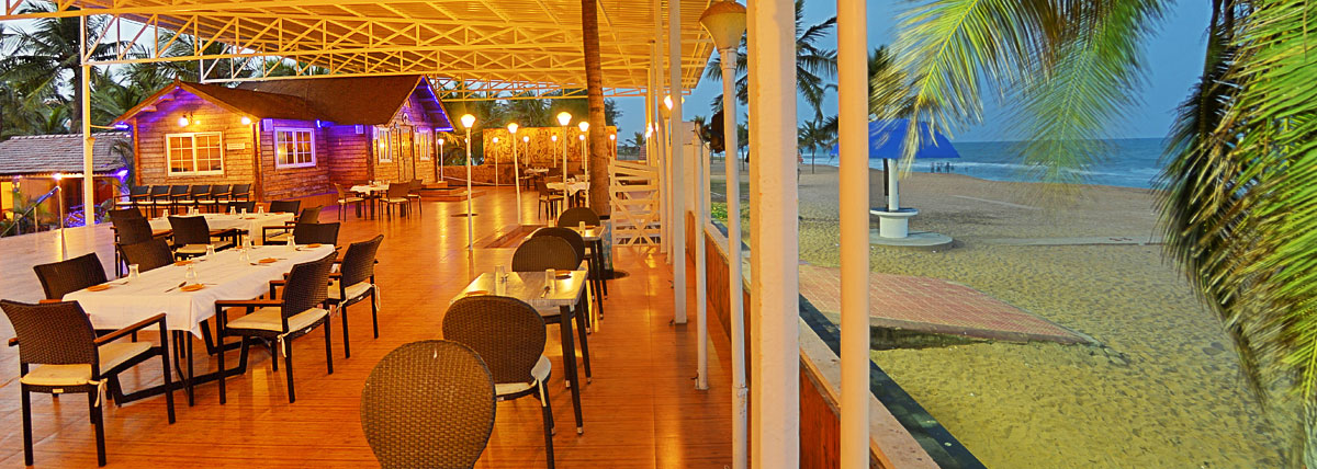 Beach restaurant's seating arrangement on the left hand side and the beach front on the right side in Bluebay beach resort, ECR, Chennai
