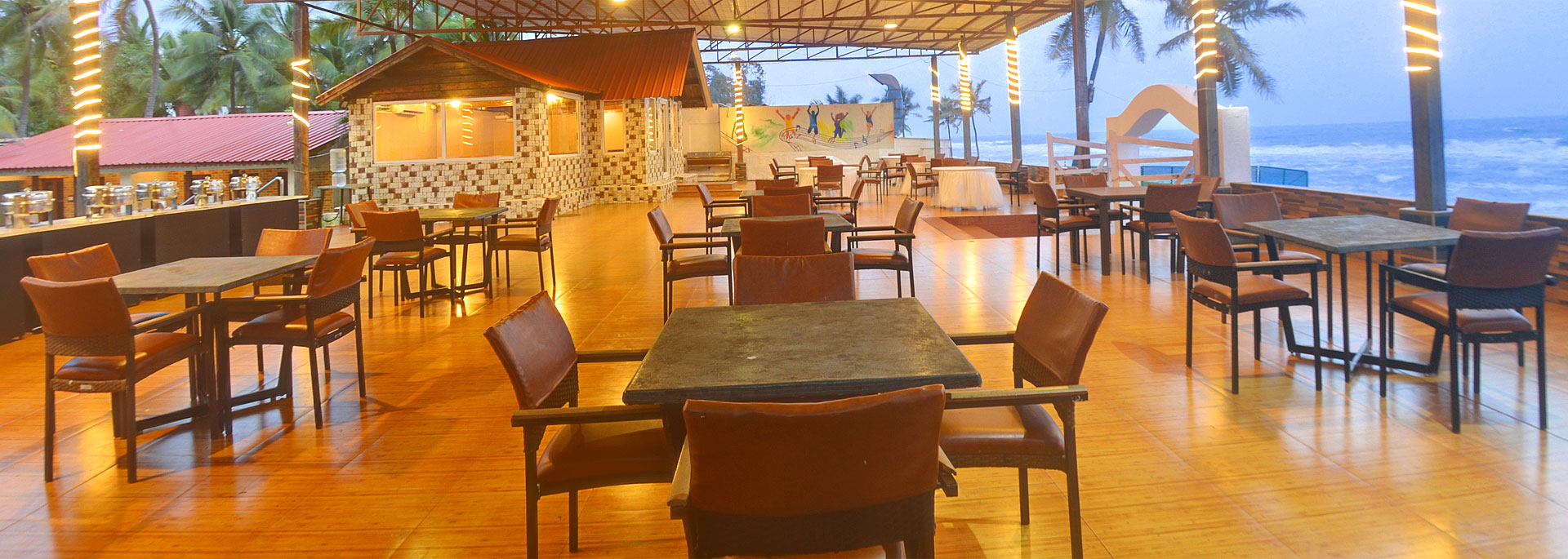 Dining arrangement of beach restaurant with spectacular view of the beach in Bluebay beach restaurant