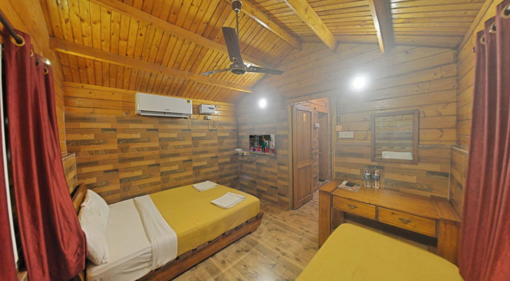Wooden Cottage single room   television with set top box, separate dining hall, chairs with table, Airconditioner in Bluebay beach resort, ECR, Chennai