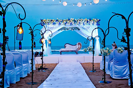Beach wedding stage with seating arrangements and lightings in Bluebay Beach Resort, ECR, Chennai