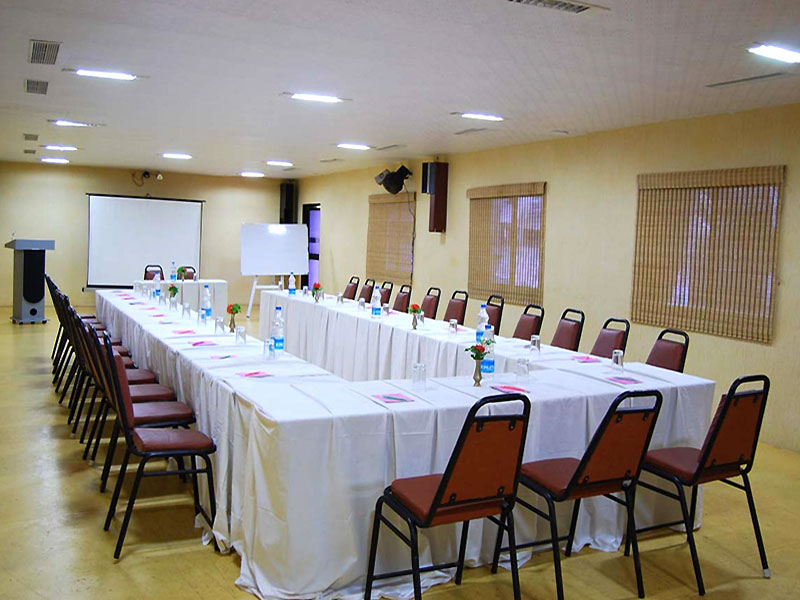 U type seating arrangementwith projector, white board, podium with mic and speaker and airconditioners in Bluebay Beach Resort, ECR, Chennai