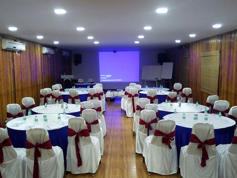 Seating arrangement in cabaret style with projector, white boards, podium with mic and speaker and airconditioners in Bluebay Beach Resort, ECR, Chennai